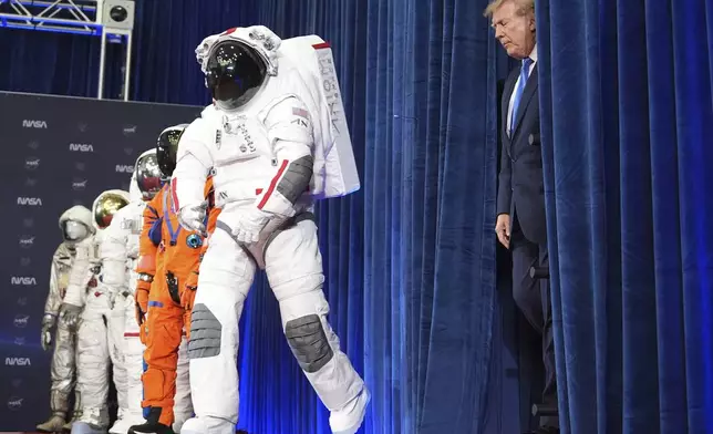 President Donald Trump arrives at an event to present the Congressional Space Medal of Honor to Artemis II crew members, Friday, Aug. 28, 2026, at Johnson Space Center in Houston. (AP Photo/Mark Schiefelbein)