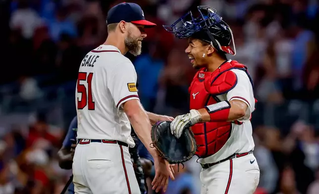 Atlanta Braves pitcher Chris Sale (51) celebrates with catcher Drake Baldwin, right after winning a baseball game shutout against the Los Angeles Dodgers, Thursday, Aug. 27, 2026, in Atlanta. (AP Photo/Erik S. Lesser)