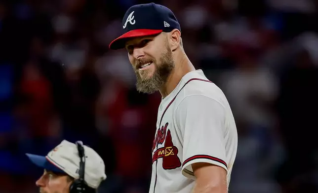 Atlanta Braves pitcher Chris Sale, right, celebrates after winning a baseball game shutout against the Los Angeles Dodgers, Thursday, Aug. 27, 2026, in Atlanta. (AP Photo/Erik S. Lesser)
