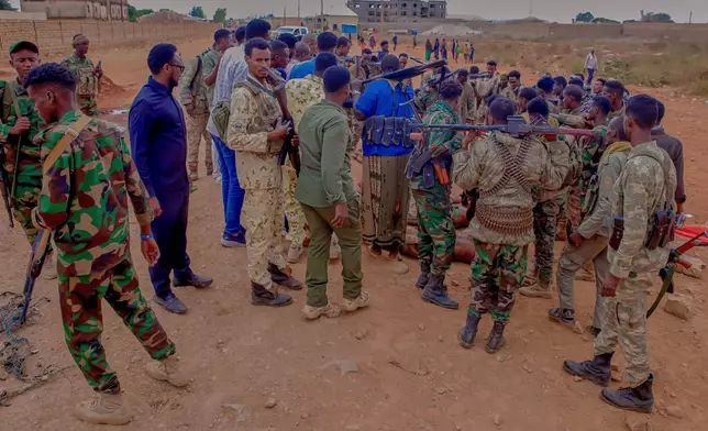 Government troops check the bodies of militia members following clashes in Baidoa, Somalia, Monday, Aug. 17, 2026. (AP Photo)