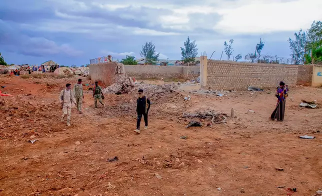 Government troops patrol alongside government officials after clashes with militias that killed dozens of people, including civilians, in Baidoa, Somalia, Monday, Aug. 17, 2026. (AP Photo)