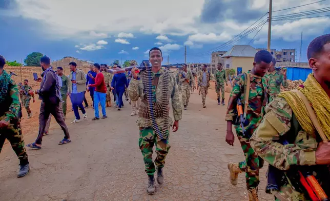 Government troops patrol alongside government officials after clashes with militias that killed dozens of people, including civilians, in Baidoa, Somalia, Monday, Aug. 17, 2026. (AP Photo/Farah Abdi Warsameh)