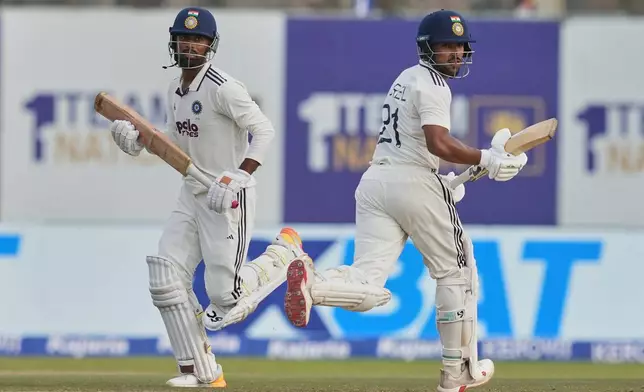 India's Dhruv Jurel, right, and India's Manav Suthar run between the wickets during the second day of the first Test cricket match between Sri Lanka and India in Galle, Sri Lanka, Sunday, Aug. 16, 2026. (AP Photo/Eranga Jayawardena)