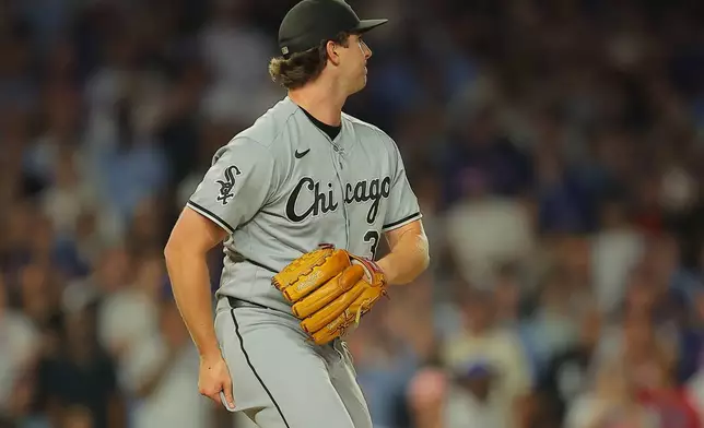 Chicago White Sox's Grant Taylor watches Chicago Cubs' Alex Bregman RBI single during the seventh inning of a baseball game, Tuesday, Aug. 18, 2026, in Chicago. (AP Photo/Melissa Tamez)