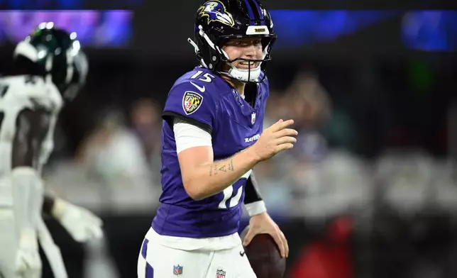 Baltimore Ravens quarterback Austin Reed (15) celebrates after scoring a touchdown against the Philadelphia Eagles during the second half of an NFL preseason football game Saturday, Aug. 15, 2026, in Baltimore. (AP Photo/Nick Wass)