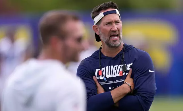 Dallas Cowboys head coach Brian Schottenheimer, right, talks with Los Angeles Rams head coach Sean McVay during an NFL football joint practice, Tuesday, Aug. 11, 2026, in Los Angeles. (AP Photo/Mark J. Terrill)
