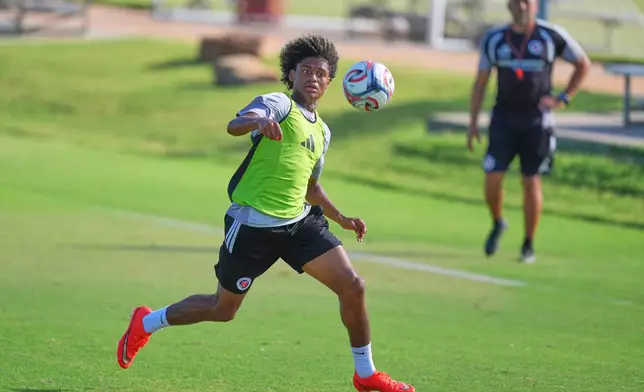 Benji Flowers plays in a scrimmage during a FC Dallas Academy soccer training session in Frisco, Texas, Friday, Aug. 14, 2026. (AP Photo/LM Otero)