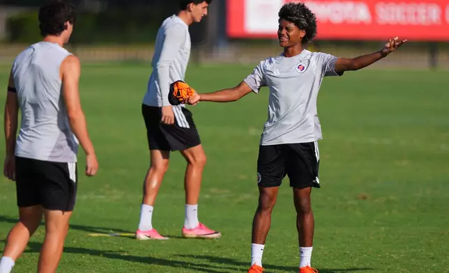 Benji Flowers gestures during a FC Dallas Academy soccer training session in Frisco, Texas, Friday, Aug. 14, 2026. (AP Photo/LM Otero)