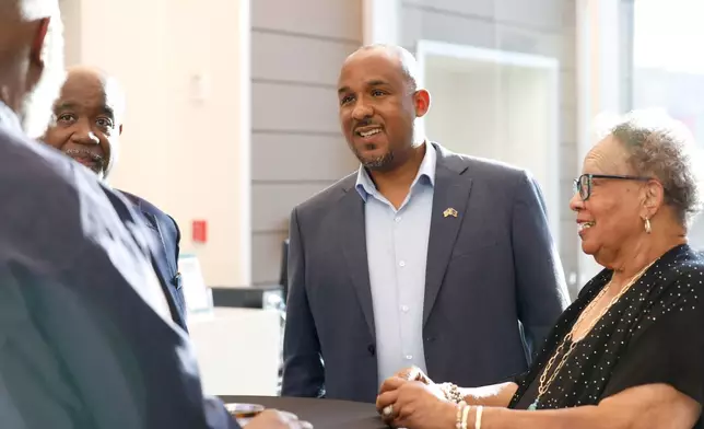Mississippi Democratic U.S. Senate candidate Scott Colom speaks with attendees at an event held at the Two Mississippi Museums in Jackson, Miss., Saturday, Aug. 1, 2026. (AP Photo/Sarah Warnock)