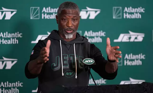 New York Jets head coach Aaron Glenn talks to reporters at the team's NFL football training camp in Florham Park, N.J., Thursday, July 30, 2026. (AP Photo/Seth Wenig)