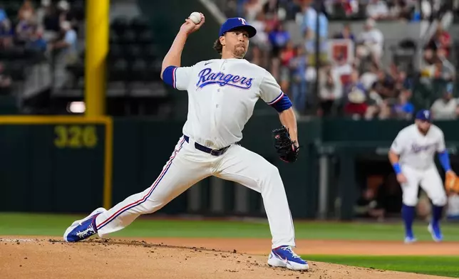 Texas Rangers pitcher Jacob deGrom throws and strikes out Washington Nationals' Abimelec Ortiz, his 2000th career strikeout, in the first inning of a baseball game Thursday, Aug. 20, 2026, in Arlington, Texas. (AP Photo/Tony Gutierrez)