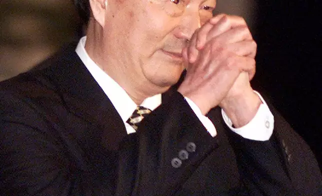 FILE - Chinese Premier Zhu Rongji greets journalists at the start of a press conference in Beijing, Wednesday March 15, 2000. (AP Photo/Greg Baker, File)