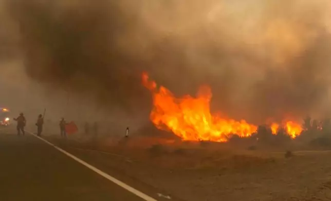 This image taken from video shows active wildfires Saturday, Aug. 22, 2026, in Reno, Nevada. (Tim Walton via AP)