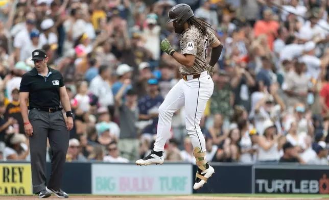San Diego Padres' Fernando Tatis Jr. runs near third base after hitting a home run during the fourth inning of a baseball game against the Houston Astros Sunday, Aug. 9, 2026, in San Diego. (AP Photo/Karl Anderson)