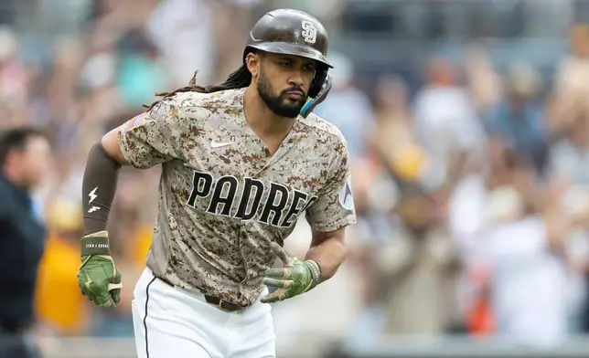 San Diego Padres' Fernando Tatis Jr. advances to first base after hitting a home run during the fourth inning of a baseball game against the Houston Astros, Sunday, Aug. 9, 2026, in San Diego. (AP Photo/Karl Anderson)