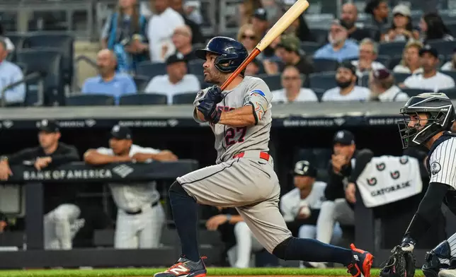 Houston Astros second baseman Jose Altuve (27) hits a RBI double during the first inning of a baseball game against the New York Yankees Wednesday, Aug. 26, 2026, in New York. (AP Photo/Ryan Murphy)