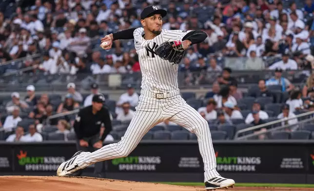 New York Yankees pitcher Elmer Rodriguez (71) pitches during the first inning of a baseball game against the Houston Astros Wednesday, Aug. 26, 2026, in New York. (AP Photo/Ryan Murphy)