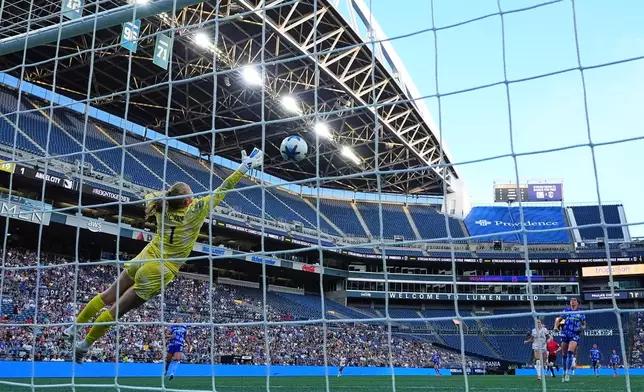 Seattle Reign FC goalkeeper Claudia Dickey can't stop the goal from Angel City FC forward Prisca Chilufya during the second half of an NWSL soccer match, Sunday, Aug. 9, 2026, in Seattle. (AP Photo/Lindsey Wasson)