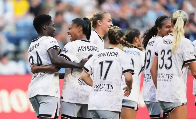 Angel City FC forward Prisca Chilufya, left, celebrates her goal with midfielder Ary Borges, second from left, against Seattle Reign FC during the second half of an NWSL soccer match, Sunday, Aug. 9, 2026, in Seattle. (AP Photo/Lindsey Wasson)