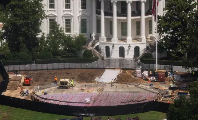 Construction continues on a helipad on the South Lawn of the White House, Wednesday, Aug. 5, 2026, in Washington. (AP Photo/Tierney L. Cross)