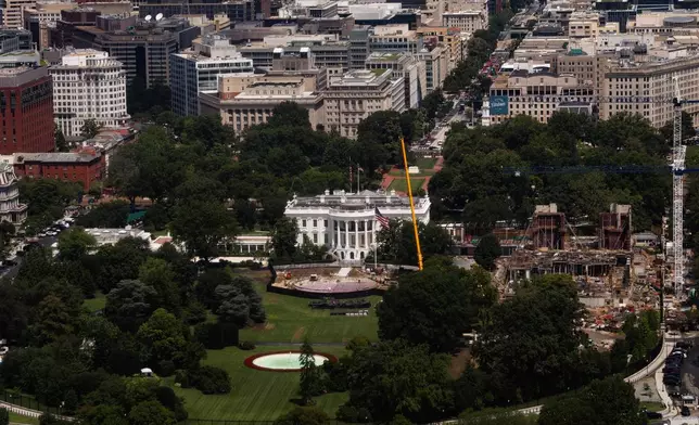 Construction continues on a helipad and the White House Ballroom on the South Lawn of the White House, Wednesday, Aug. 5, 2026, in Washington. (AP Photo/Tierney L. Cross)