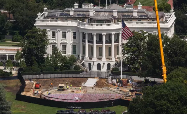 Construction continues on a helipad on the South Lawn of the White House, Wednesday, Aug. 5, 2026, in Washington. (AP Photo/Tierney L. Cross)