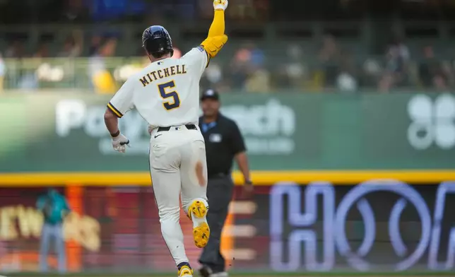 Milwaukee Brewers' Garrett Mitchell reacts to hitting a home run during the eighth inning of a baseball game against the Seattle Mariners Thursday, Aug. 20, 2026, in Milwaukee. (AP Photo/Kayla Wolf)