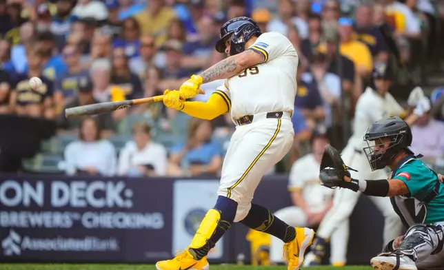 Milwaukee Brewers' Gary Sánchez (99) hits a two-run double, allowing Brice Turang and Jake Bauers to score, during the first inning of a baseball game against the Seattle Mariners, Thursday, Aug. 20, 2026, in Milwaukee. (AP Photo/Kayla Wolf)