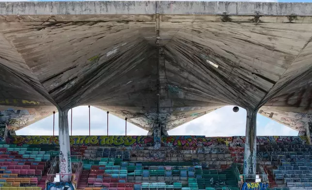The Miami Marine Stadium's seats are shaded by a concrete cantilevered roof Tuesday Aug. 11, 2026, in Miami. (AP Photo/Daniel Kozin)