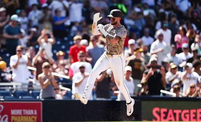 San Diego Padres' Jackson Merrill runs the bases after hitting a solo home run against the Minnesota Twins in the seventh inning of a baseball game Sunday, Aug. 23, 2026, in San Diego. (AP Photo/Derrick Tuskan)