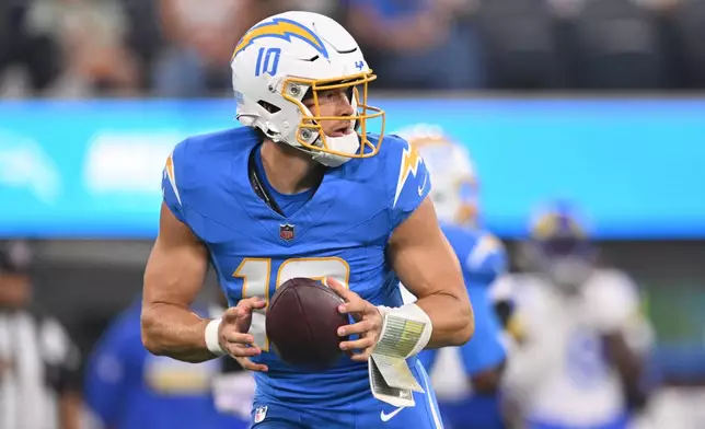Los Angeles Chargers quarterback Justin Herbert drops back to pass during the first half of an NFL preseason football game against the Los Angeles Rams Thursday, Aug. 27, 2026, in Inglewood, Calif. (AP Photo/Katie Chin)