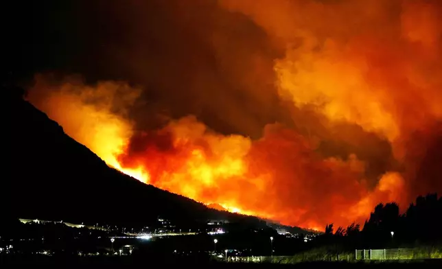 A general view of a wildfire near Omis, southern Croatia early Friday, Aug. 14, 2026. (AP Photo/Jakov Prkic)