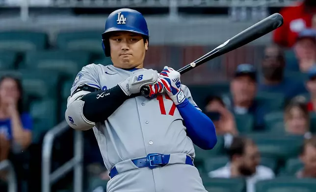 Los Angeles Dodgers designated hitter Shohei Ohtani (17) avoids an inside pitch from Atlanta Braves pitcher Bryce Elder during the second inning of a baseball game, Tuesday, Aug. 25, 2026, in Atlanta. (AP Photo/Erik S. Lesser)