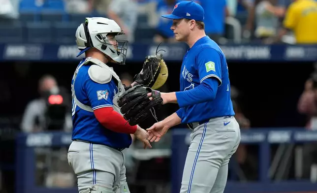 Toronto Blue Jays pitcher Louis Varland, right, celebrates with catcher Alejandro Kirk after closing out the Tampa Bay Rays during the ninth inning of a baseball game Thursday, Aug. 20, 2026, in St. Petersburg, Fla. (AP Photo/Chris O'Meara)
