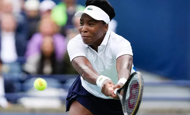 Venus Williams plays a return against Kamilla Rakhimova during the National Bank Open tennis tournament in Toronto, Sunday, Aug. 2, 2026. (Chris Young/The Canadian Press via AP)