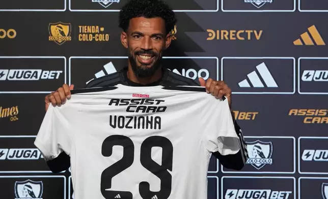 Cape Verde goalkeeper Vozinha poses for photos during his presentation as a new player for Colo Colo at Monumental stadium in Santiago, Chile, Tuesday, Aug. 4, 2026. (AP Photo/Esteban Felix)