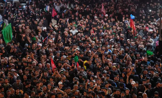 Shiite worshippers gather between the holy shrines of Imam Hussein and Imam Abbas, ahead of Arbaeen, the annual Shiite commemoration marking 40 days after Ashoura, at the Imam Hussein Shrine in Karbala, Iraq, Monday, Aug. 3, 2026. (AP Photo/Hadi Mizban)