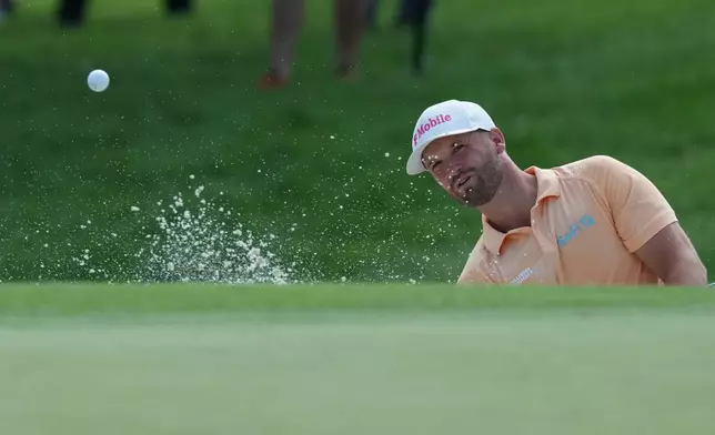 Wyndham Clark hits from the bunker on the first hole during the first round of the BMW Championship golf tournament Thursday, Aug. 20, 2026, in St. Louis. (AP Photo/Jeff Roberson)