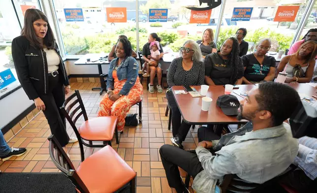 Rep. Haley Stevens, D-Mich., a candidate in the Democratic primary for U.S. Senate in Michigan, speaks during a campaign event at Corine's Soul Food, Cakes & Catering Monday, Aug. 3, 2026, in Muskegon Heights, Mich. (AP Photo/Paul Sancya)