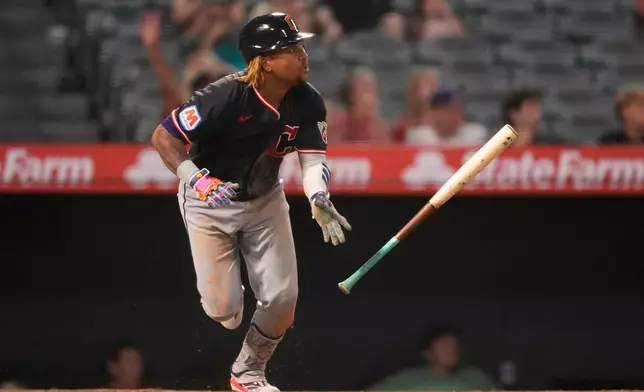 Cleveland Guardians' José Ramírez heads to first for an RBI double during the 10th inning of a baseball game against the Los Angeles Angels, Tuesday, Aug. 25, 2026, in Anaheim, Calif. (AP Photo/Mark J. Terrill)