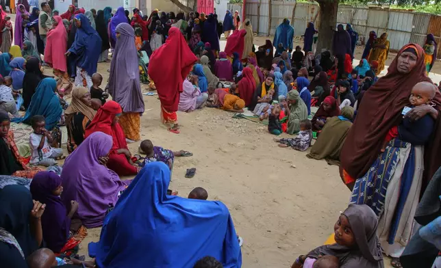 Somali women displaced by drought sit at Feynuus Nutrition Centre on the outskirts of the capital, Mogadishu, Somalia, Wednesday, Aug. 19, 2026. (AP Photo/Farah Abdi Warsameh)