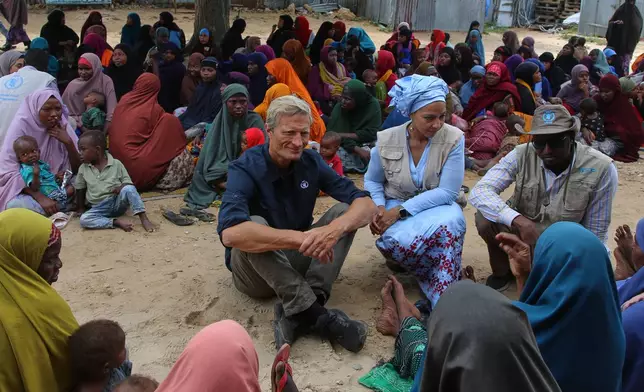 Acting Executive Director of the World Food Programme (WFP) Carl Skau, center, meets Somali women displaced by drought at Feynuus Nutrition Centre on the outskirts of the capital, Mogadishu, Somalia, Wednesday, Aug. 19, 2026. (AP Photo/Farah Abdi Warsameh)
