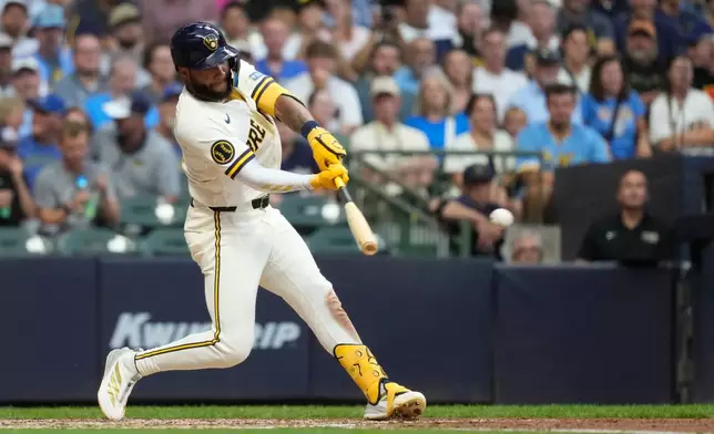Milwaukee Brewers' Jackson Chourio hits an RBI single during the fourth inning of a baseball game against the Pittsburgh Pirates, Tuesday, Aug. 4, 2026, in Milwaukee. (AP Photo/Aaron Gash)