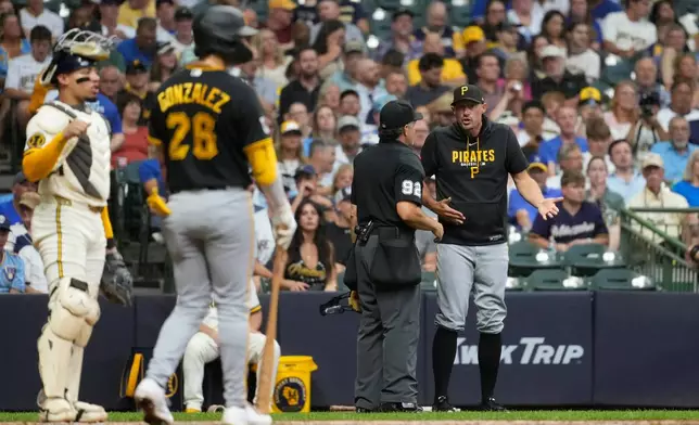Pittsburgh Pirates manager Don Kelly argues with umpire James Hoye (92) during the fifth inning of a baseball game against the Milwaukee Brewers, Tuesday, Aug. 4, 2026, in Milwaukee. (AP Photo/Aaron Gash)