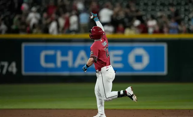 Arizona Diamondbacks' Tim Tawa rounds the bases after hitting a home run against the San Diego Padres during the third inning of a baseball game, Wednesday, Aug. 5, 2026, in Phoenix. (AP Photo/Ross D. Franklin)