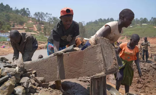People search for gold at a mining site in Iga-Barrière, Ituri province, eastern Congo, Friday, Aug. 14, 2026. (AP Photo/Dieudonne Dirole)