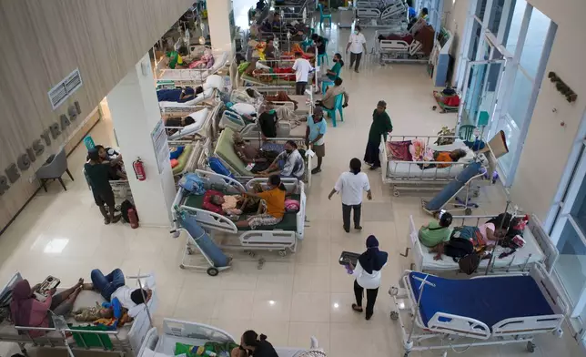 Patients are treated in the hallway of a hospital following an earthquake in Labuan Bajo, East Nusa Tenggara province, Indonesia, Saturday, Aug. 15, 2026. (AP Photo/Firdia Lisnawati)