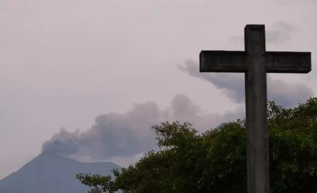 Clouds of ash spew from crater of the Fuego volcano, as seen from San Pedro Las Huertas, Guatemala, Tuesday, Aug. 4, 2026. (AP Photo/Moises Castillo)