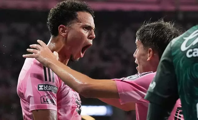 Inter Miami defender Ian Fray, left, reacts after forward Daniel Pinter, right, scored a goal during the first half of a Leagues Cup soccer match against Club León, Wednesday, Aug. 12, 2026, in Miami. (AP Photo/Lynne Sladky)