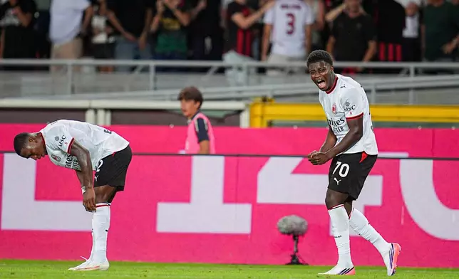 Milan's Alphadjo Cisse celebrates after scoring the 1-0 goal against Torino FC during a Serie A soccer match in Turin, Italy, Sunday, Aug. 23, 2026. (Marco Alpozzi/LaPresse via AP)